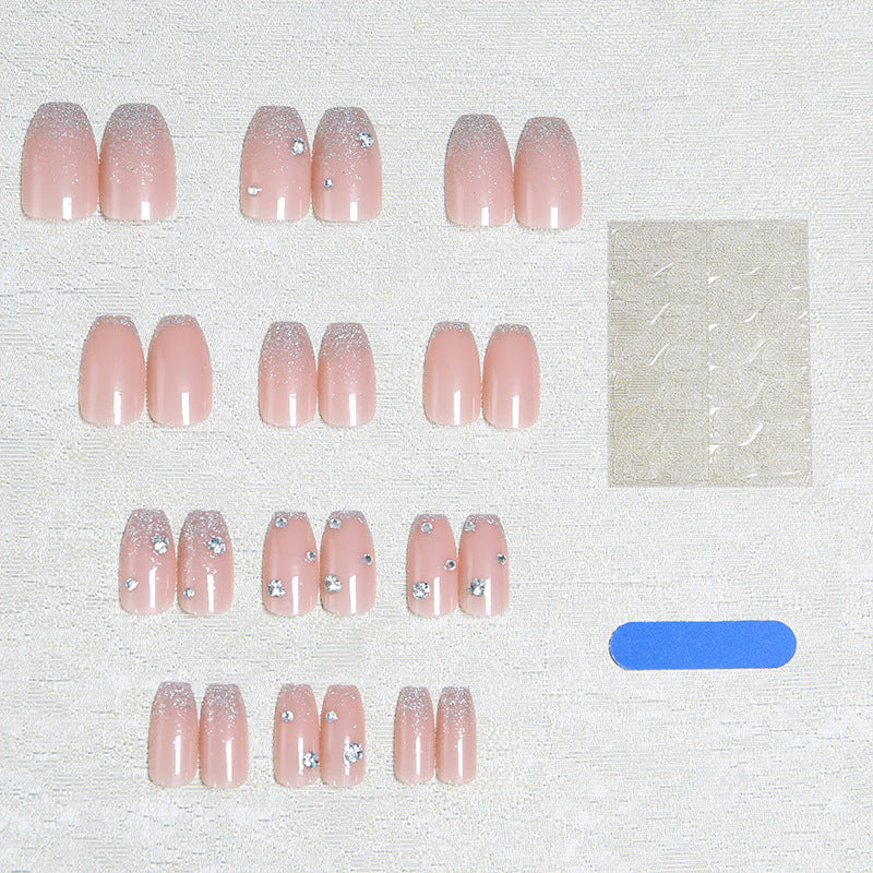 Glamorous artificial nails with glitter and rhinestone embellishments Bowlift