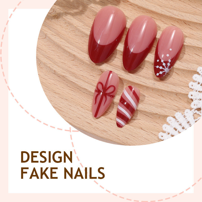Artificial nail set with festive bow and stripe designs Bowlift