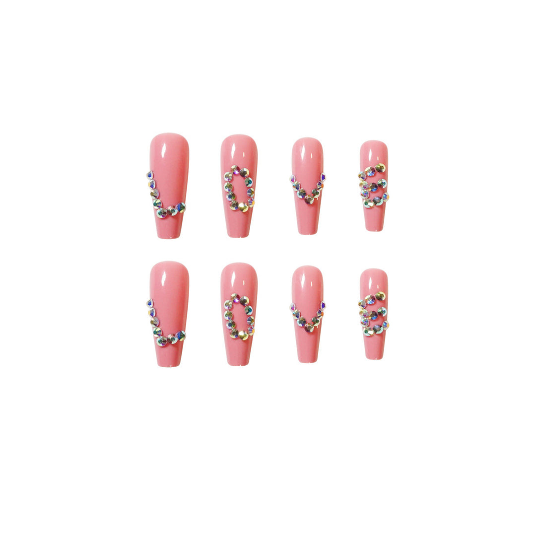 Artificial nail extensions with elegant rhinestone embellishments Bowlift