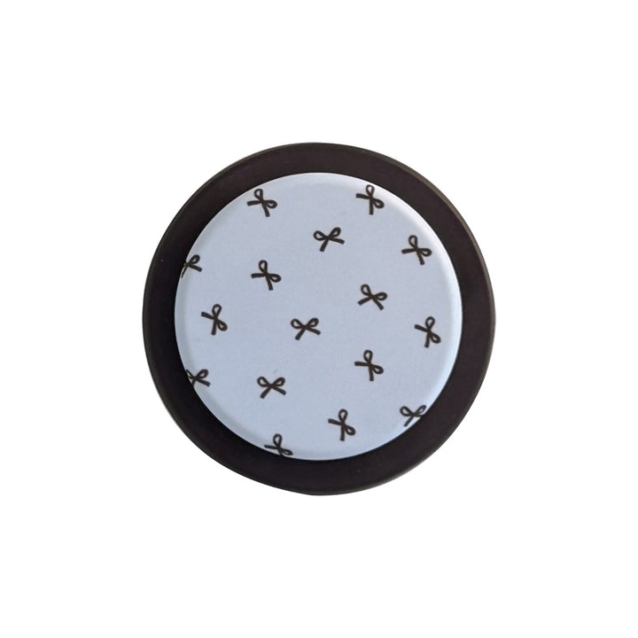 Decorative coaster with bow motif Bowlift