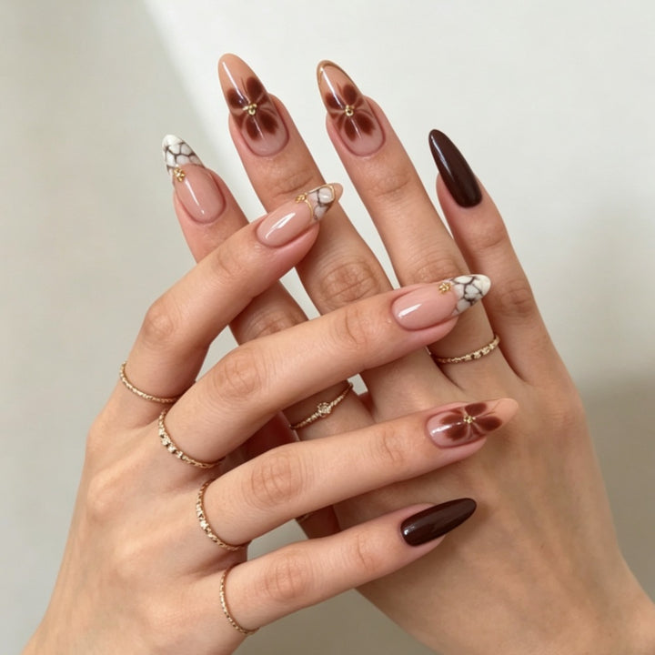 Artificial nails with elegant marble pattern and delicate accents Bowlift