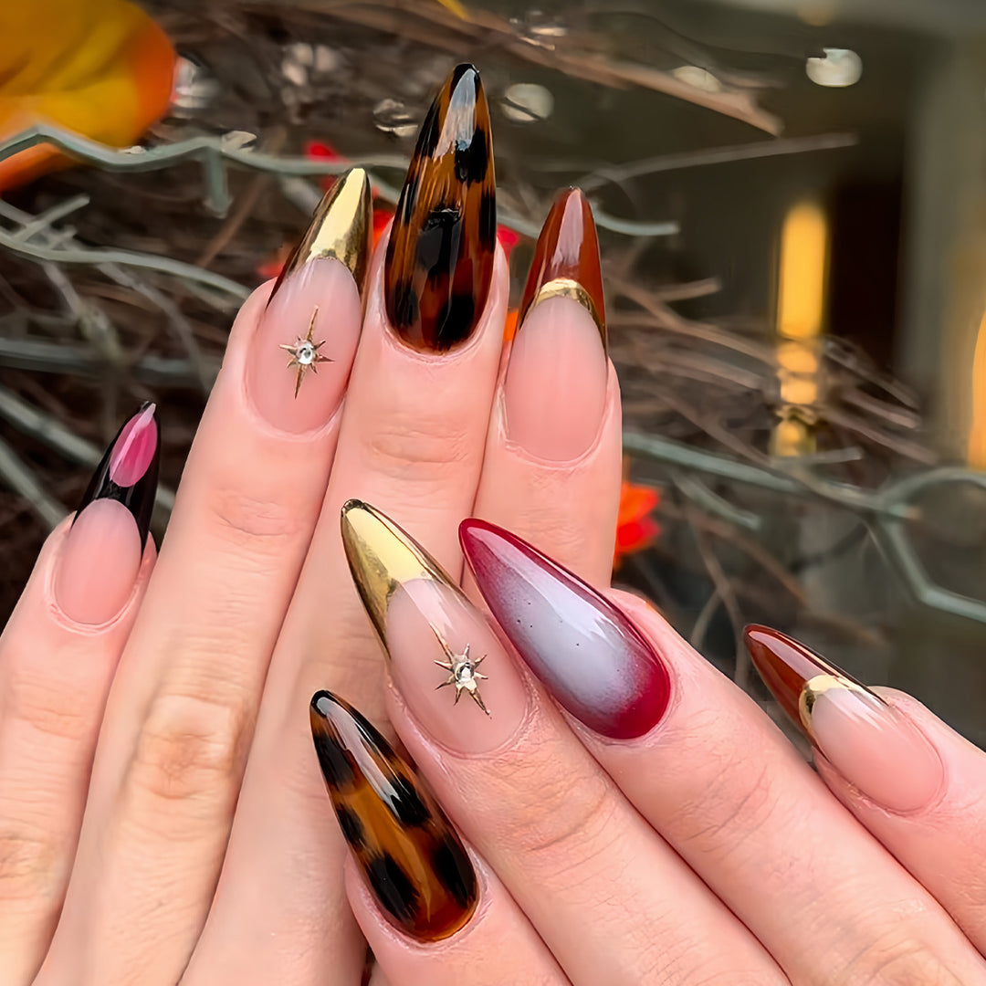 Artistic Stiletto Press-On Nails with Metallic Accents Bowlift