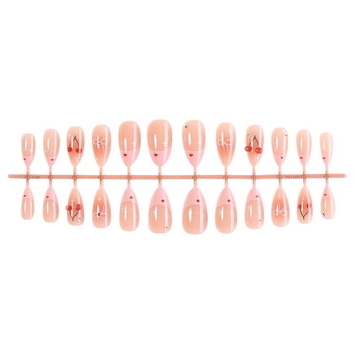 Artifical nails with playful heart and bow designs Bowlift