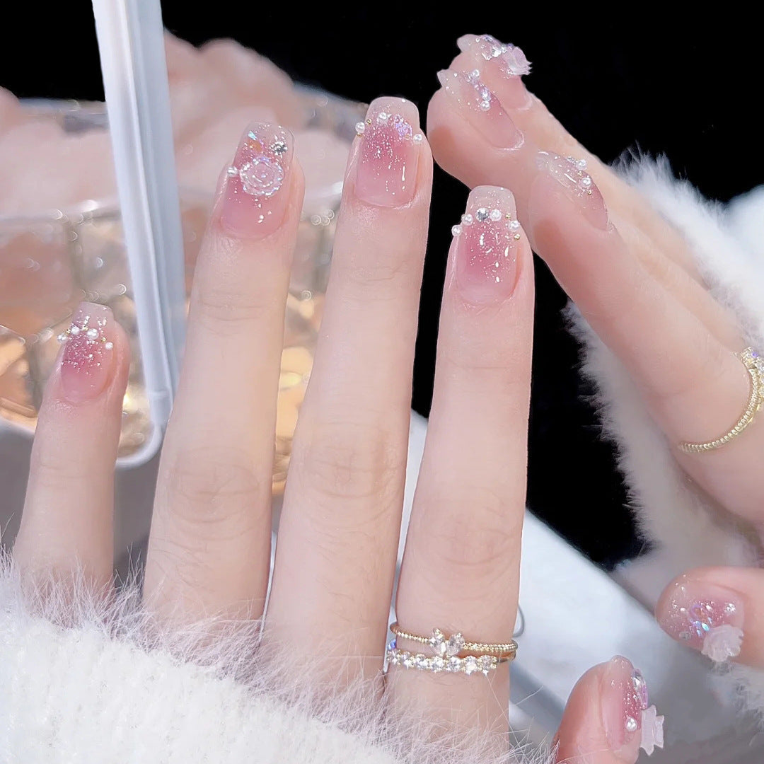 Glamorous artificial nails with heart and glitter details Bowlift