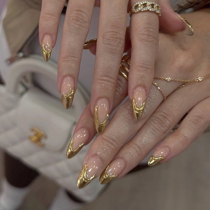 Stiletto Nail Enhancements with Gold Accents Bowlift