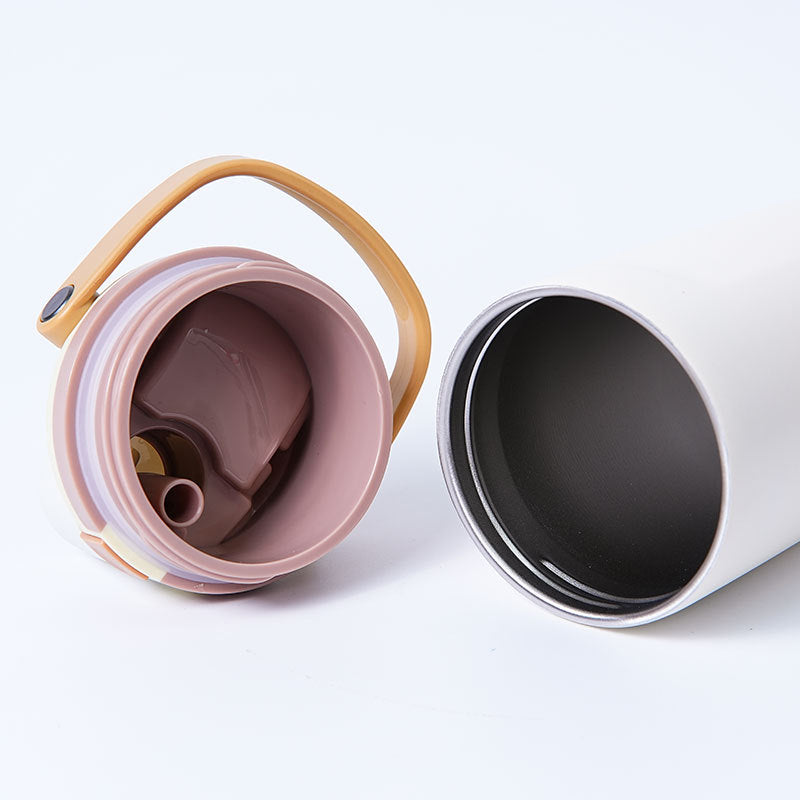 Unisex double-walled vacuum drinking bottle made of stainless steel with one-handed click closure and carrying handle Bowlift