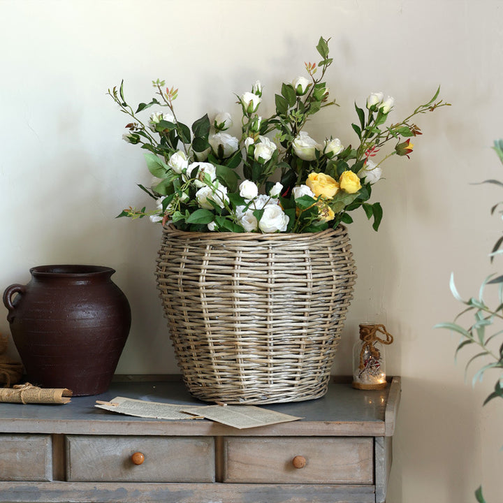 Stylish laundry basket made of braided natural material Bowlift
