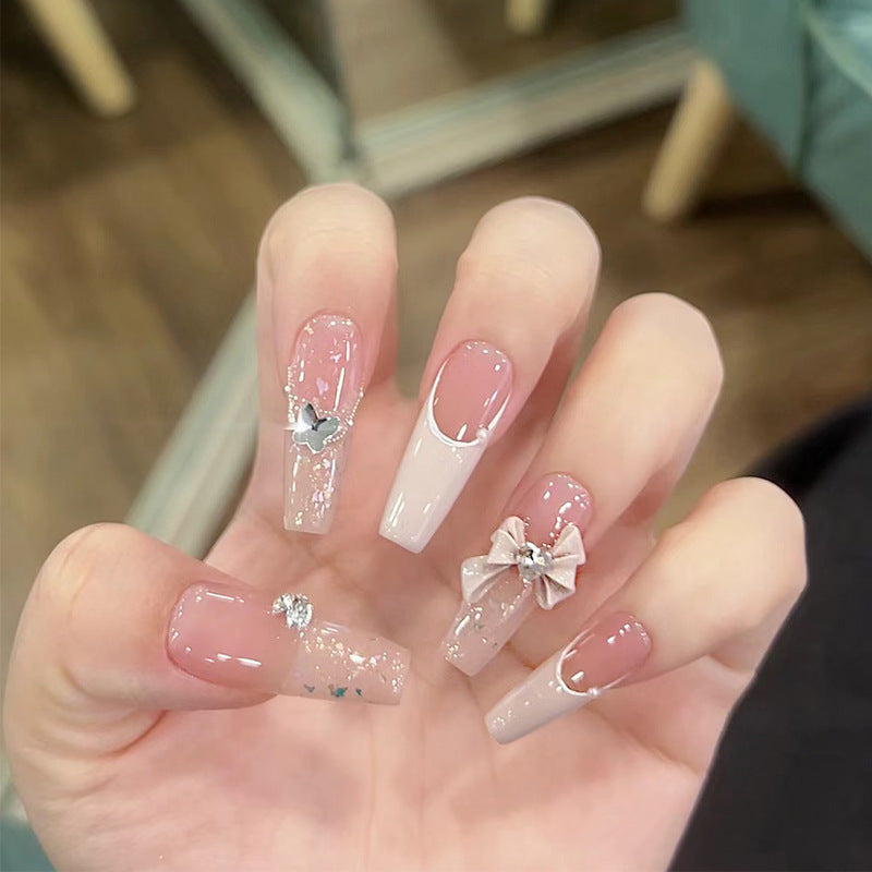 Artificial nails with glitter accents and playful motifs Bowlift
