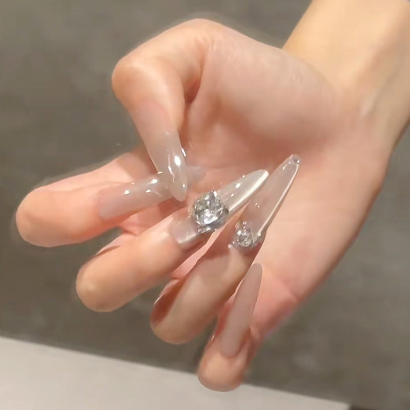 Acrylic nail set with glitter design and elegant 3D applications Bowlift