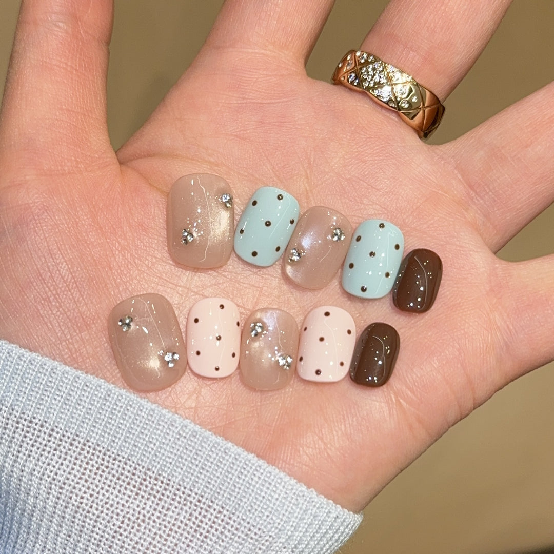 Acrylic nails with rhinestones and glitter Bowlift