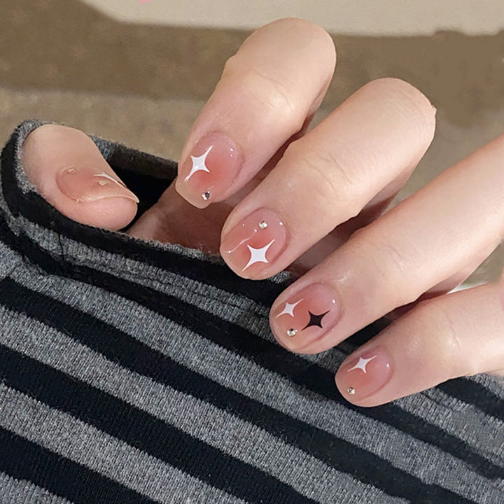 Acrylic nail set with sparkling star decorations and elegant accents Bowlift