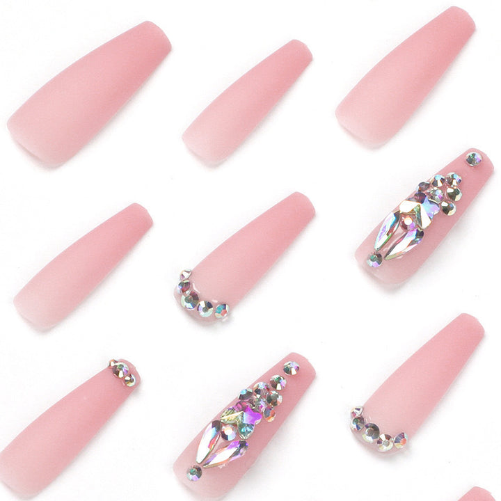 Artificial nails with rhinestone embellishments Bowlift