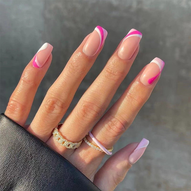 Acrylic nail extensions with elegant gradient and curved accents Bowlift