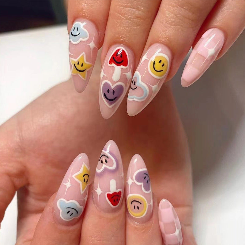 Creative nail art with playful emoji motifs Bowlift