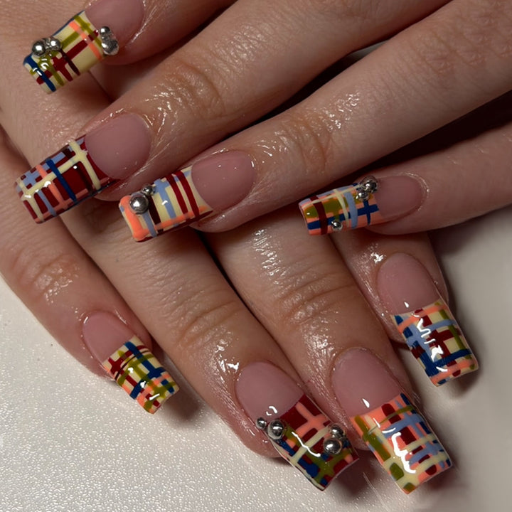 Artificial nails with geometric patterns and glossy accents Bowlift