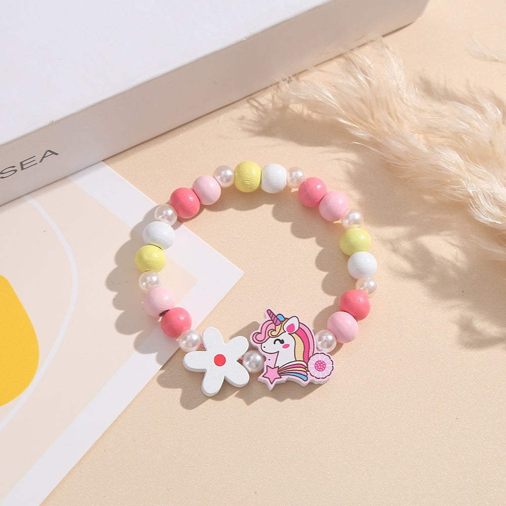 Playful children's bracelet with unicorn and flower motif Bowlift
