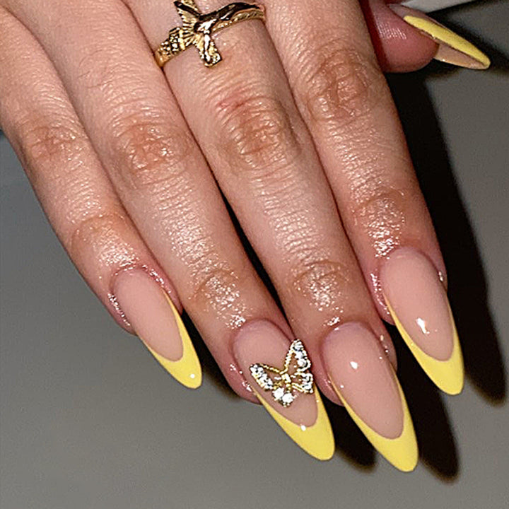 Artful stiletto nails with glamorous butterfly design Bowlift