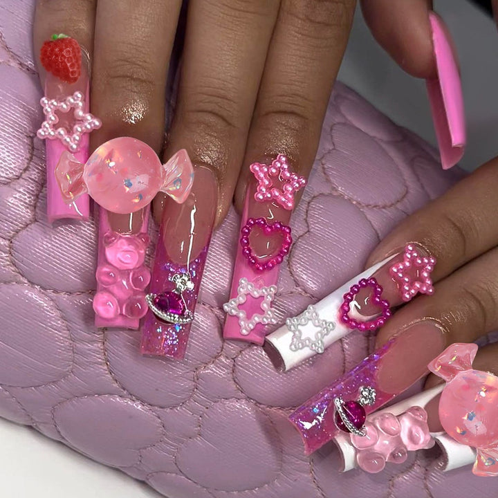 Glamorous artificial nail set with sparkling rhinestones and cross decorations Bowlift