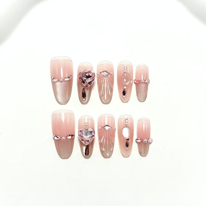 Artificial nails with sparkling heart and rhinestone accents Bowlift