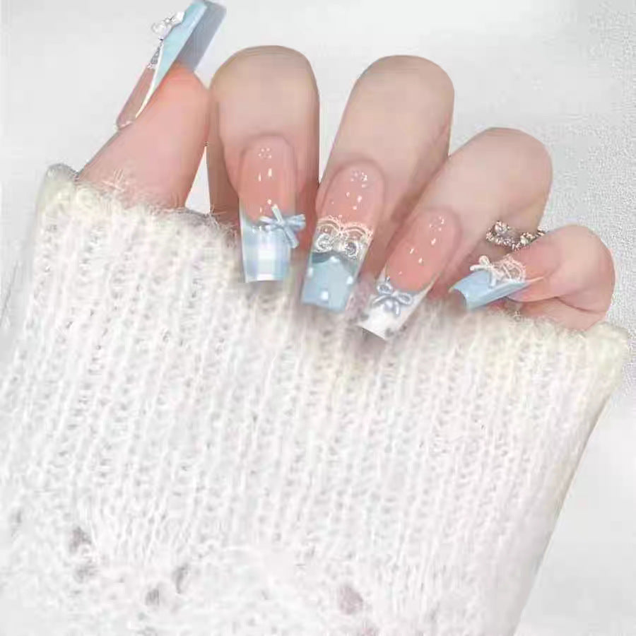 Artistic Press-On Nail Extensions with Floral Embellishments Bowlift