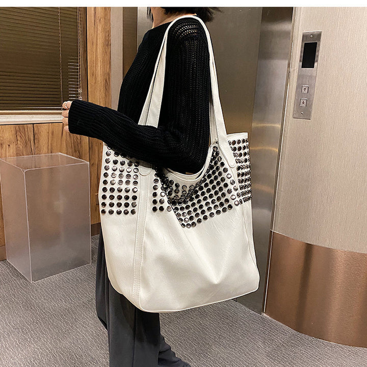 Fashionable shoulder bag with stylish rivet details Bowlift