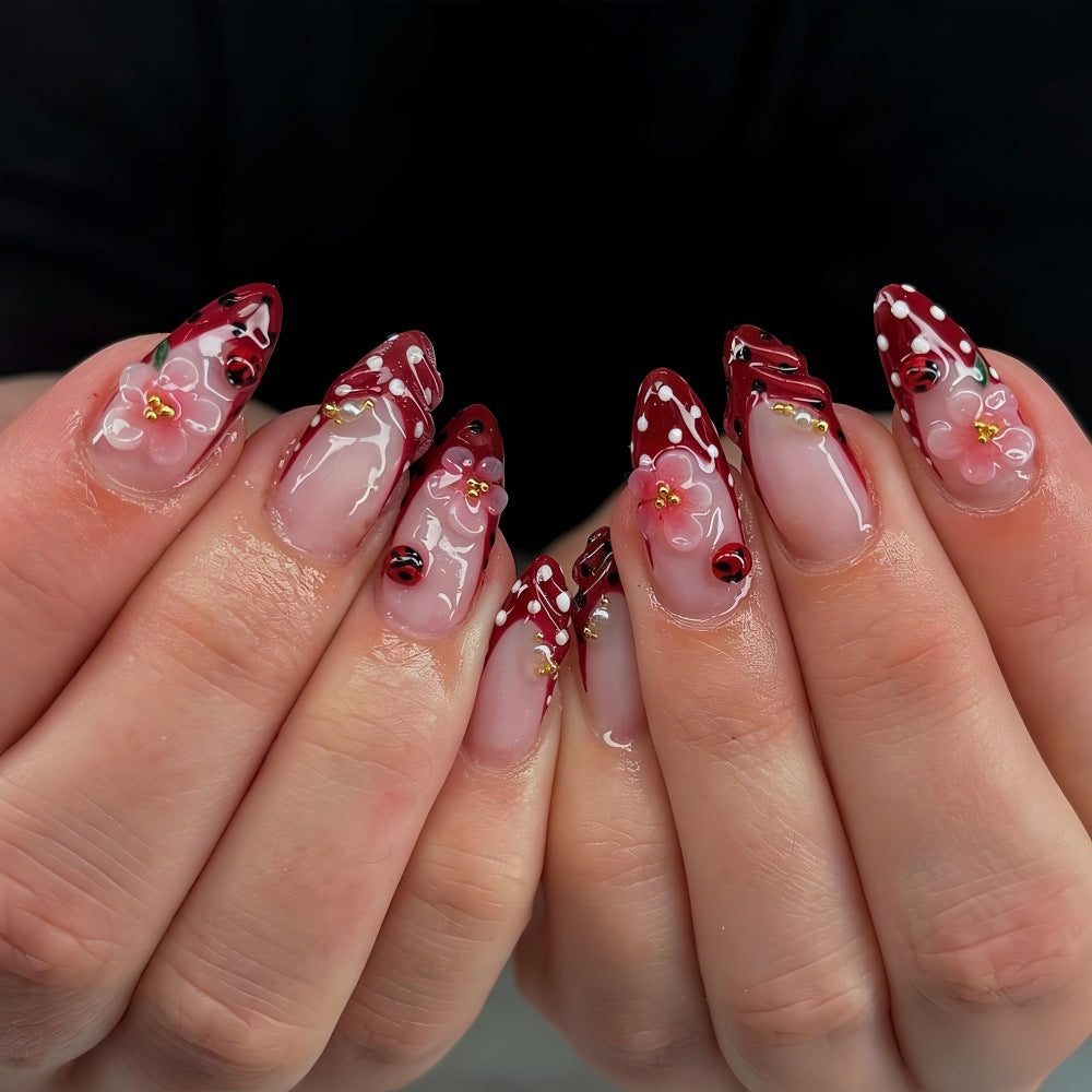 Artificial nails with floral design and 3D accents Bowlift