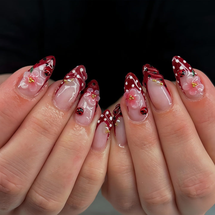 Artificial nails with floral design and 3D accents Bowlift