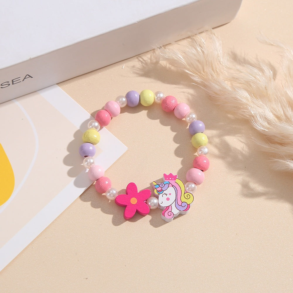 Playful children's bracelet with unicorn and flower motif Bowlift