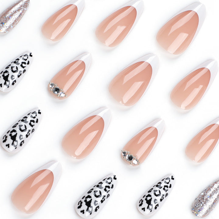 Artful stiletto nails with leopard patterns and glitter accents Bowlift