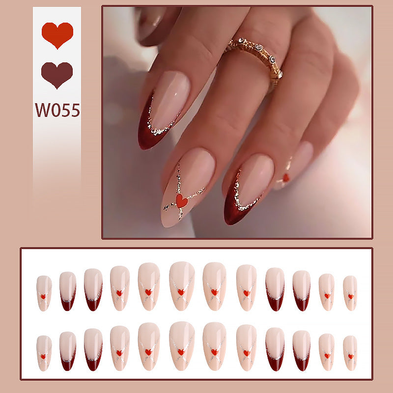 Acrylic nails with heart motifs and glitter details Bowlift
