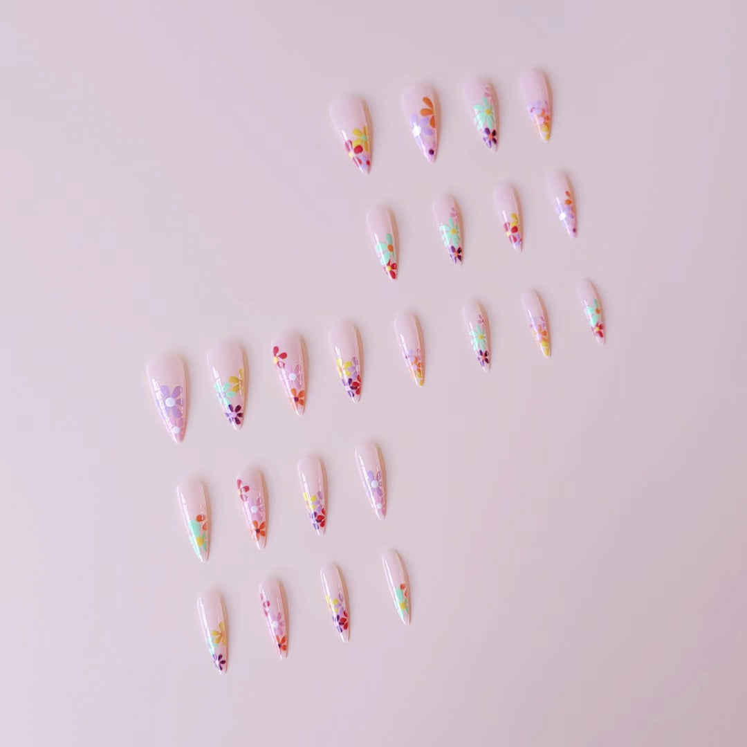 Acrylic nail set with vibrant floral designs and sharp accents Bowlift