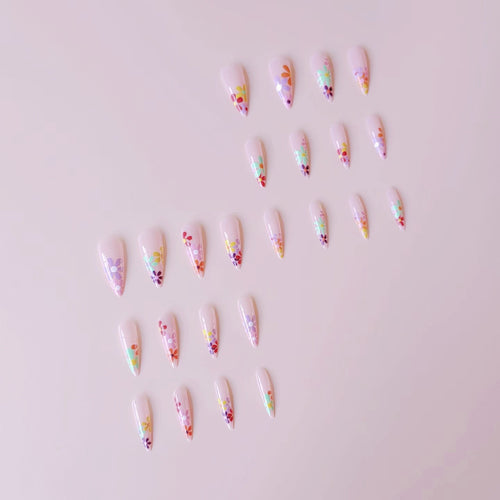 Acrylic nail set with vibrant floral designs and sharp accents Bowlift