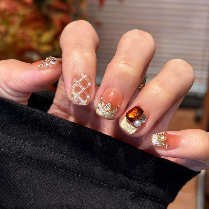 Artificial nail set with festive gift design and elegant glitter accents Bowlift