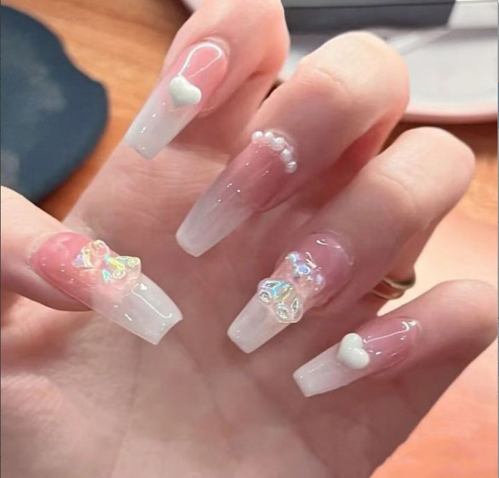 Glamorous nail art with pearls and glitter Bowlift