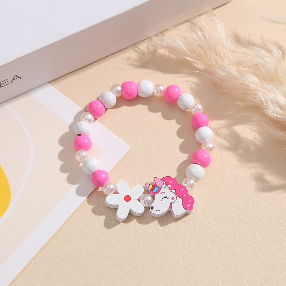 Playful children's bracelet with unicorn and flower motif Bowlift