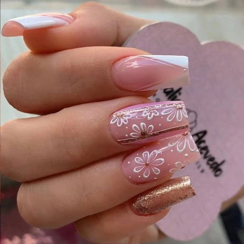 Artful Gel Nails with Elegant Floral Design and Glitter Accents Bowlift