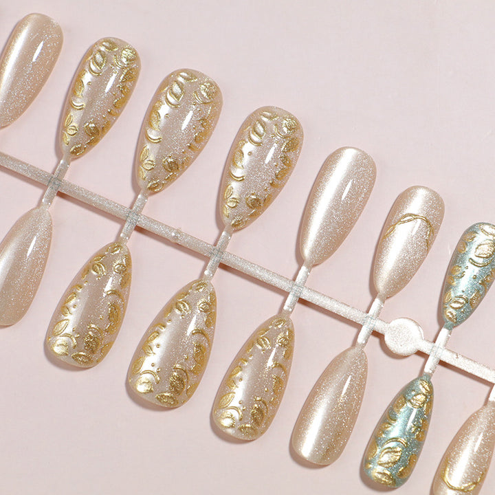 Artistic Stiletto Press-On Nail Set with Elegant Gold Accents Bowlift