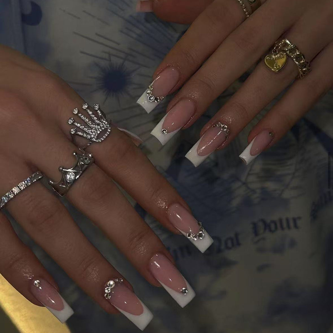 Acrylic nail set with elegant high-gloss finish and luxury rhinestone embellishments Bowlift