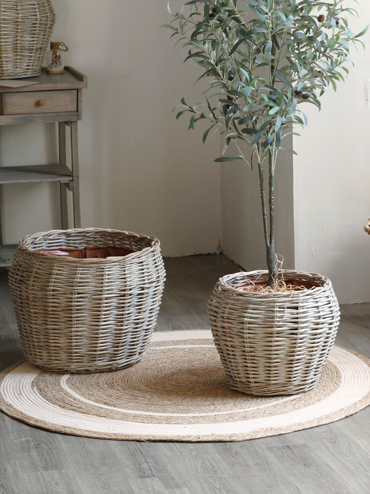 Stylish laundry basket made of braided natural material Bowlift