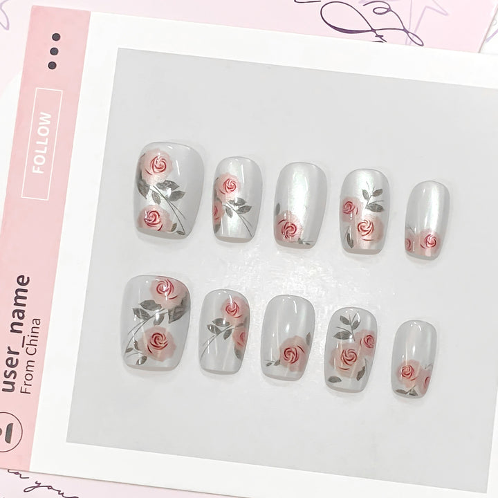 Artful nail extensions with rose designs Bowlift