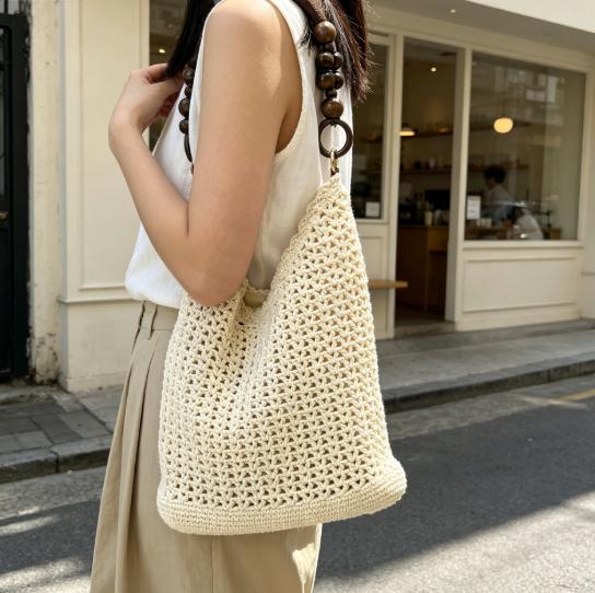 Hand-knotted bucket bag with wooden handles Bowlift