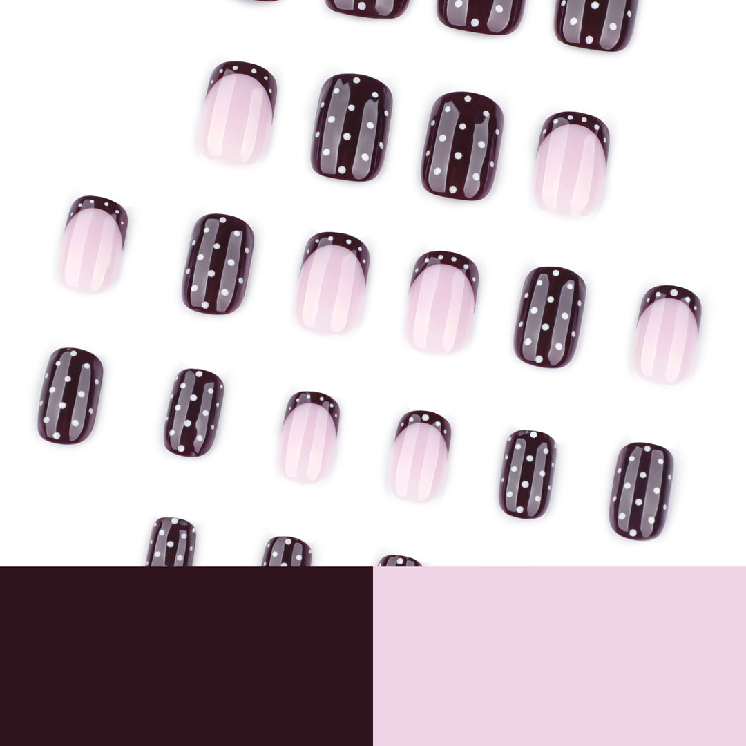 Artful nail art with elegant polka dot design Bowlift