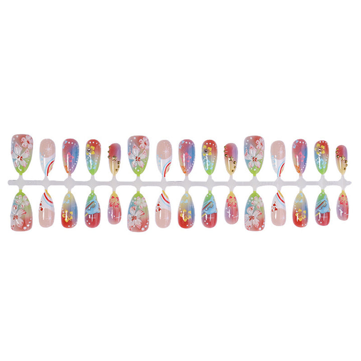 Artificial nail set with various designs and shiny embellishments Bowlift