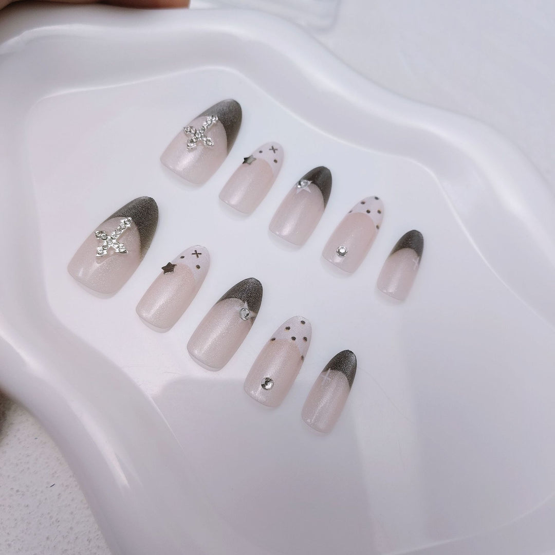 Glittering artificial nail design with elegant accents Bowlift