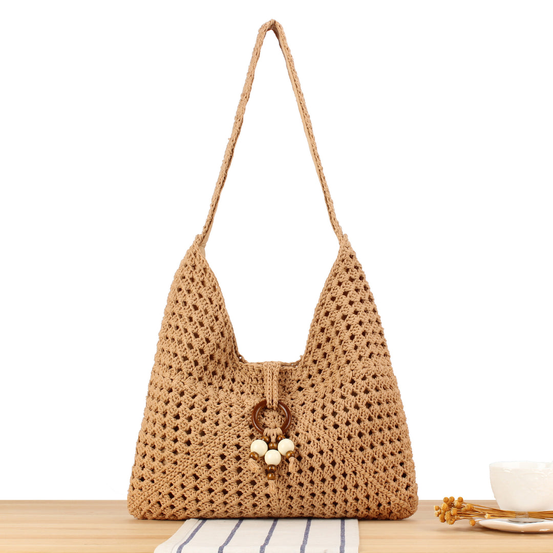 Handbag made of hand-knotted natural material with chic tassel decoration Bowlift