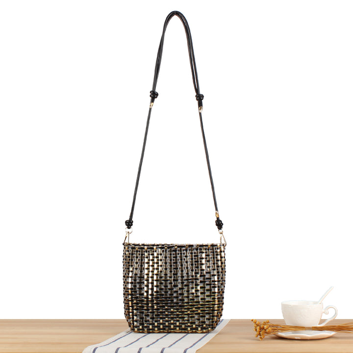 Shoulder bag made of handwoven synthetic material with fashionable sliding mechanism Bowlift