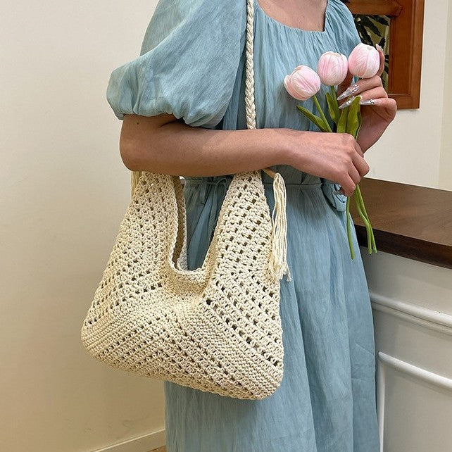 Hand-knotted shoulder bag with tassels and spacious interior Bowlift