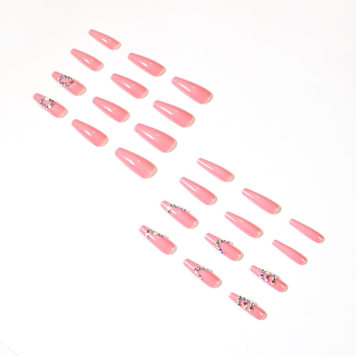 Artificial nail extensions with elegant rhinestone embellishments Bowlift