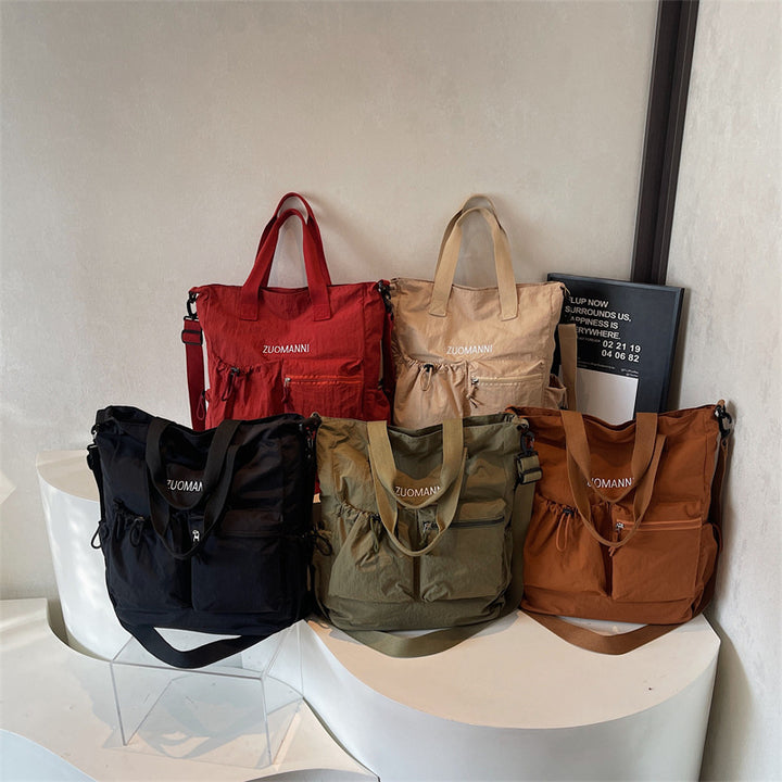 Tote bag with multifunctional outer pockets and adjustable shoulder strap Bowlift