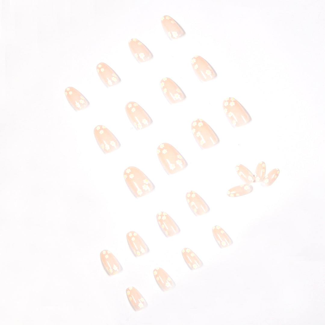 Artificial nail art with floral design and glitter accents Bowlift